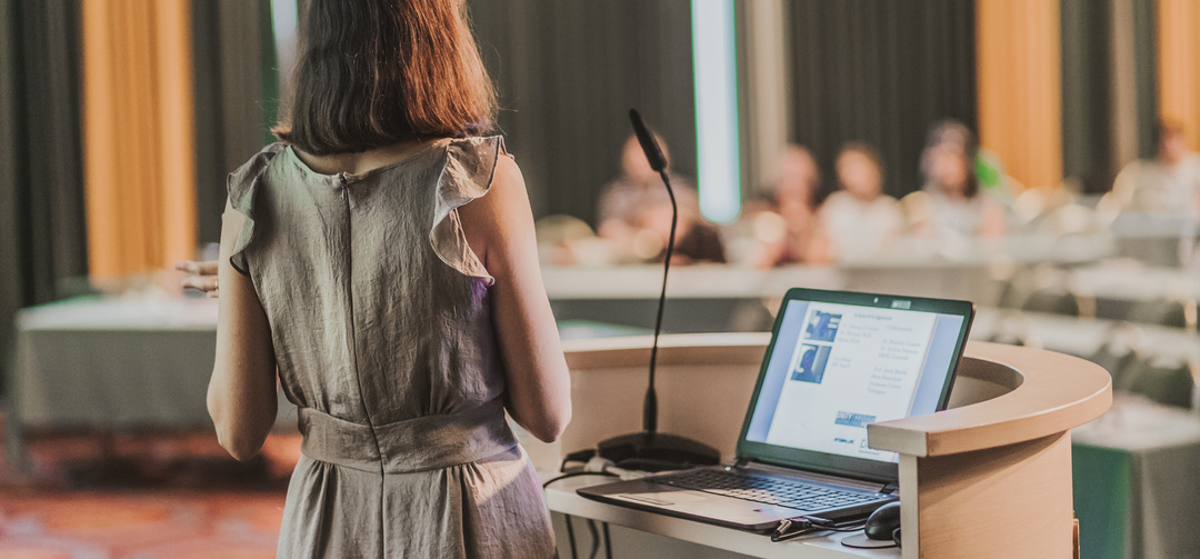 Female Speaker at Business Conference 